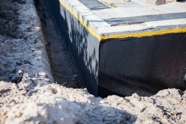 Professional Waterproofing technician working in Watson, AL